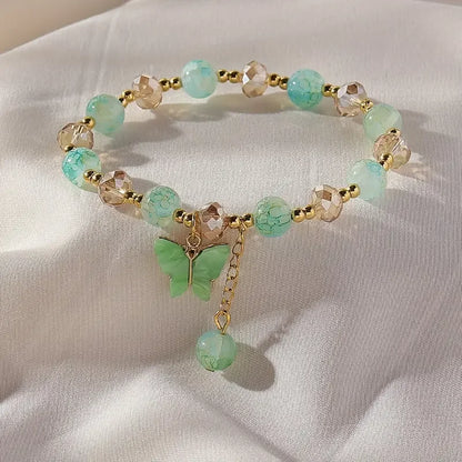Elastic Bracelet with Faceted Beads and Butterfly Charm